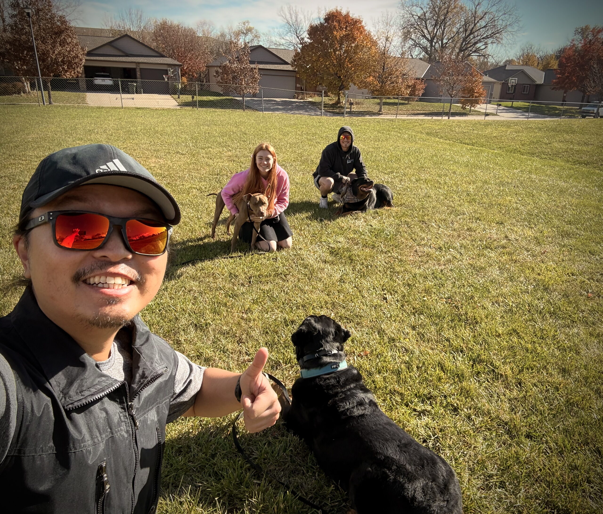Derek Chiu with clients and dogs at Bark N Train community event in Nebraska
